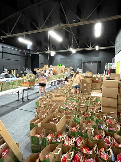 Bags of groceries are packed for community members in need.
