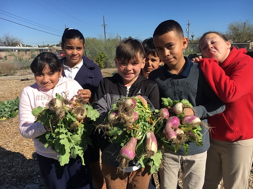 Students celebrate in the garden