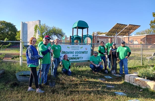 Volunteers with the Day of Service program pose for a group photo.
