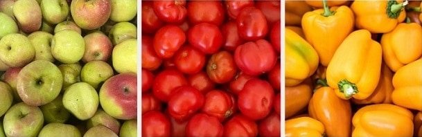 A photo of apples, tomatoes, and yellow bell peppers.